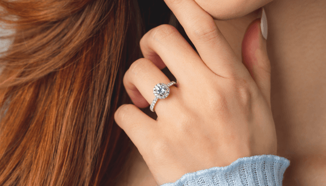 Woman wearing engagement rings.